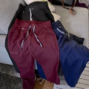Figs brand scrub pants. All jogger style leg.  Black, blue, burgundy